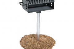 Ultra play pedestal grills on some grass.
